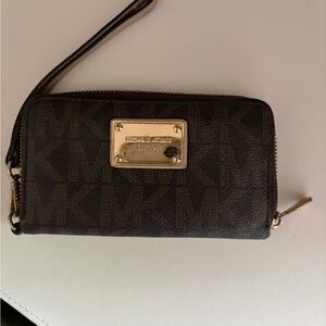 Michael Kors Dark Brown Monogram Zip Wristlet with God Accents